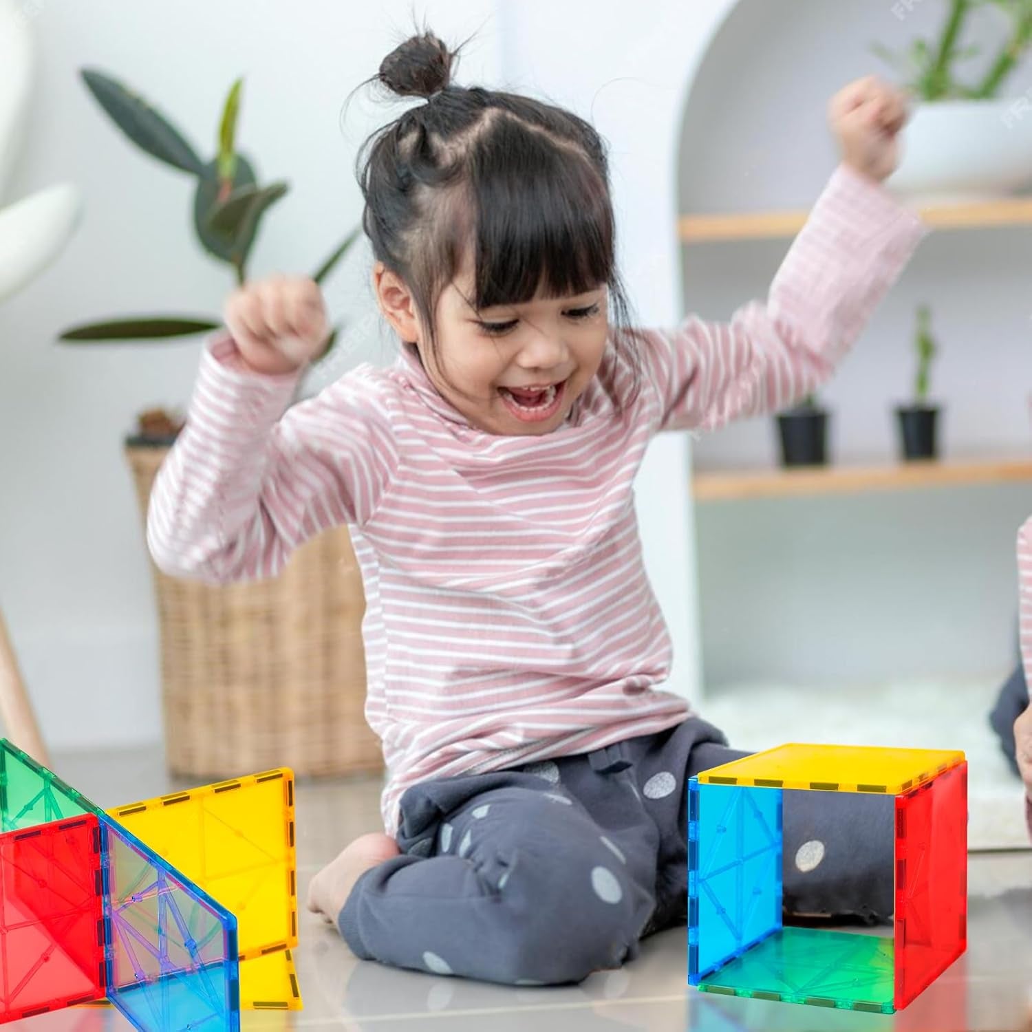Magnetic tiles in yellow, teal, blue and red colours